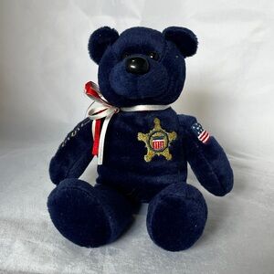 Navy Blue Crista Bear with Badge and Ribbon, collectible.